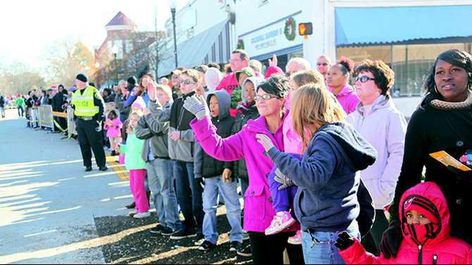 a crowd looks on at the Covington parade