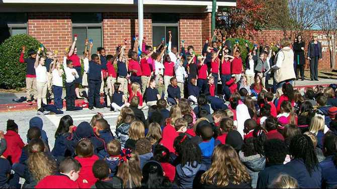 Newton County Theme School raises blue ribbon flag - The Covington News