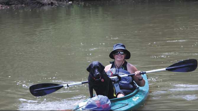 Tonya-Bechtler-chair-of-Yellow-River-Water-Trails-flaots-with-her-dog-River-2