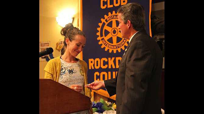Outgoing-president-David-Cooper-gives-new-president-Ashely-Roessler-a-silver-dollar-given-to-him-by-Pat-Atkins-IMG 5750