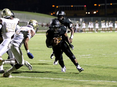 In his first game back from injury, Alcovy’s Natorien Holloway (2) runs it in the end zone against the Salem defense.