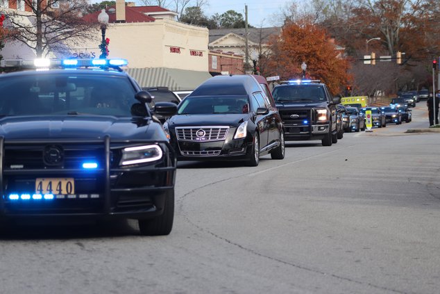 almond turner arrives home via law enforcement escort