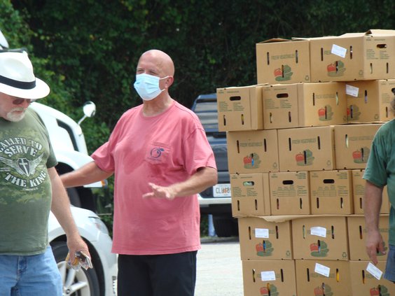 Clay Ivey helps distribute food