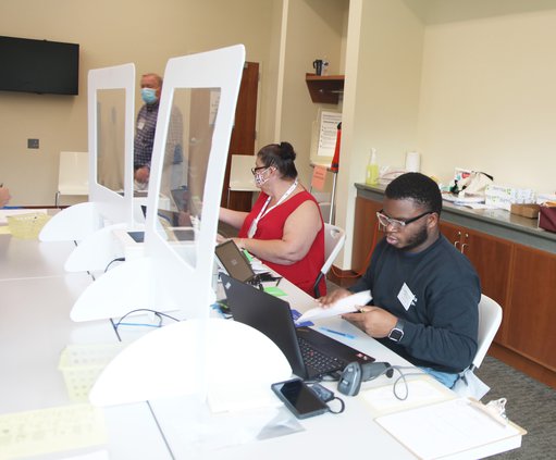 Newton County election workers Amanda Martin and Josh Porter