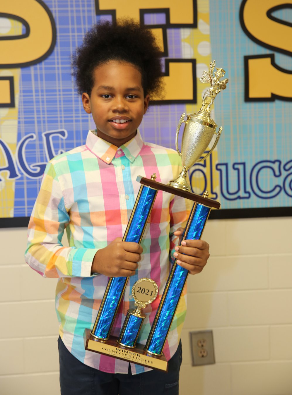 Porterdale fourthgrader wins 'different' Newton schools' spelling bee