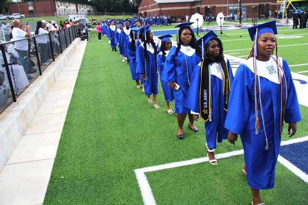 Graduating seniors make their way to the seating area at the start of Newton High Commencement Exercises at Sharp Stadium on Wednesday, May 22, [2].jpg