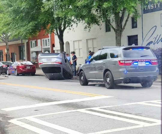 Car flips over during single-vehicle accident near City Pharmacy